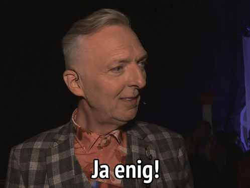 Man In Plaid Jacket Says Ja Enig GIF