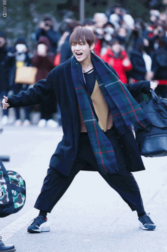 Man in Plaid Scarf and Black Coat