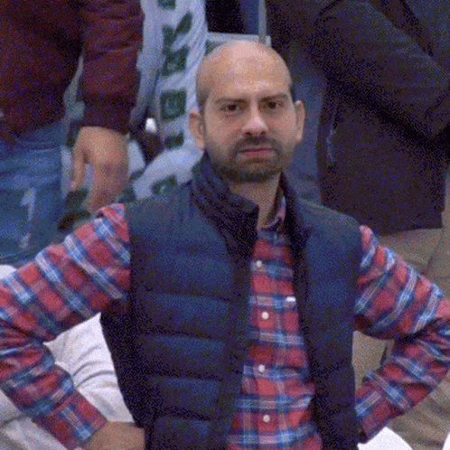 Man in Plaid Shirt and Blue Vest