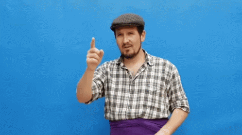 Man In Plaid Shirt And Hat Waving On Blue Background GIF