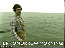 Man in Plaid Shirt and Overalls Fishing