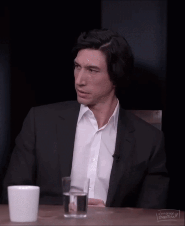 Man In Plaid Shirt And Suspenders Looking Over Shoulder GIF