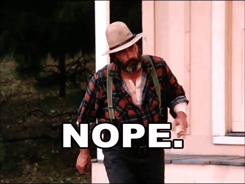 Man in Plaid Shirt and Suspenders with Nope