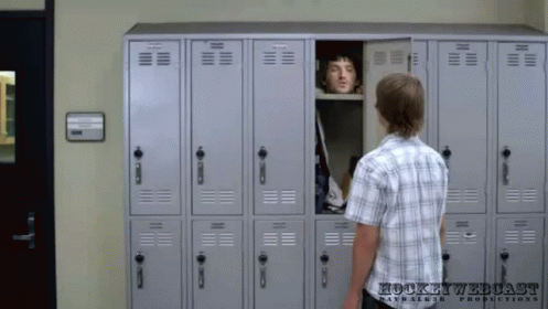 Man in Plaid Shirt at Hockey Webcast Locker