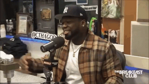 Man in Plaid Shirt at Microphone The Breakfast Club