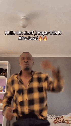 Man in Plaid Shirt Dancing Says Hello Um Deaf I Hope This Is Afro Beat