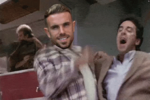 Man in Plaid Shirt Dancing With Man in Suit