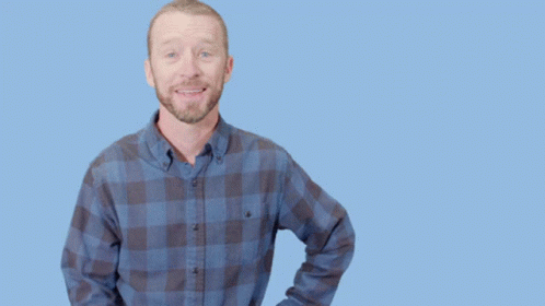 Man in Plaid Shirt Doing Call Me Gesture