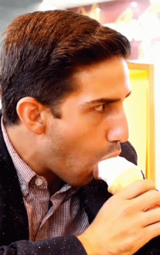 Man In Plaid Shirt Eating Vanilla Ice Cream GIF