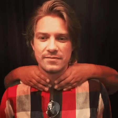 Man In Plaid Shirt Getting Neck Massage GIF