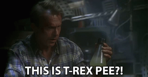 Man In Plaid Shirt Holding Bottle Says This Is T-Rex Pee GIF
