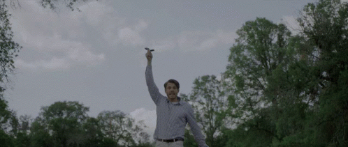 Man In Plaid Shirt Holding Lightning Bolt GIF