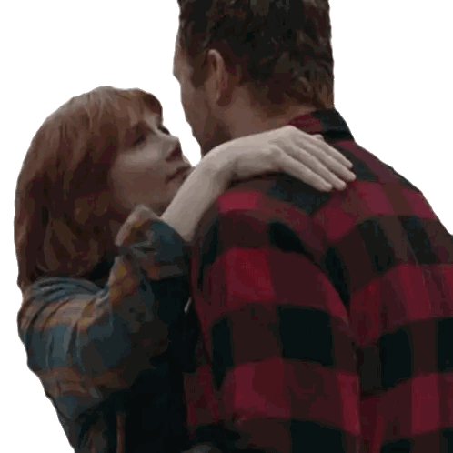 Man in Plaid Shirt Hugging Woman