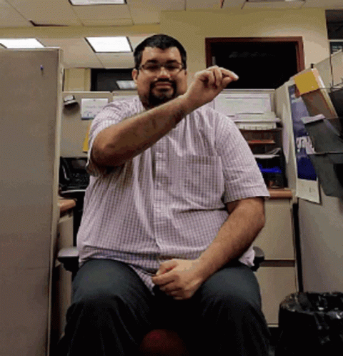 Man In Plaid Shirt In Cubicle Saying A GIF