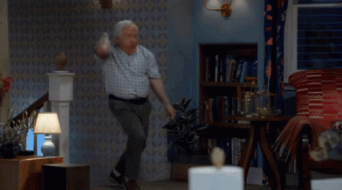 Man In Plaid Shirt Jumping GIF