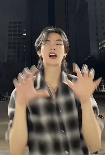 Man in Plaid Shirt Making Face With Hands Outstretched