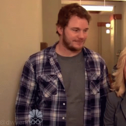 Man in Plaid Shirt Next to Woman