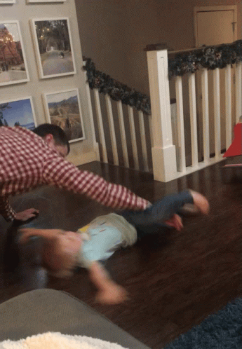 Man In Plaid Shirt Playing With Child GIF