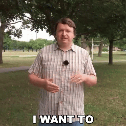 Man in Plaid Shirt Saying I Want To in Park