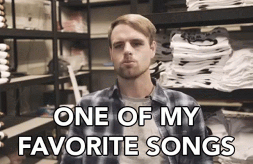 Man in Plaid Shirt Singing