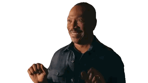Man in Plaid Shirt Smiling and Raising Hands