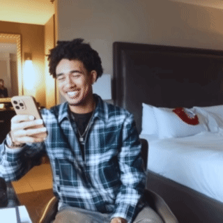 Man in Plaid Shirt Taking Selfie