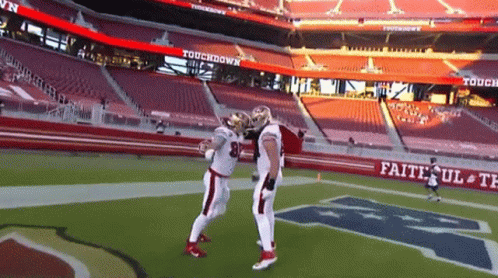 Man in Plaid Shirt Waving Says Kittle First TD