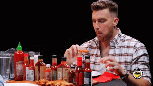 Man in Plaid Shirt With Hot Sauces