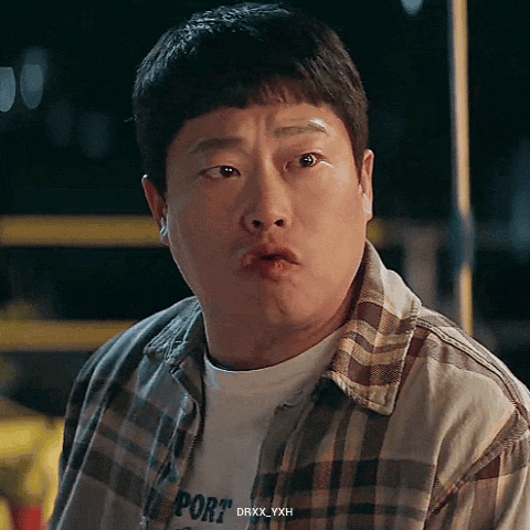 Man in Plaid Shirt With Port Making Funny Face