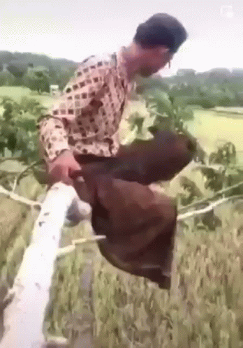 Man In Plaid Shirt With Rope Around Waist GIF