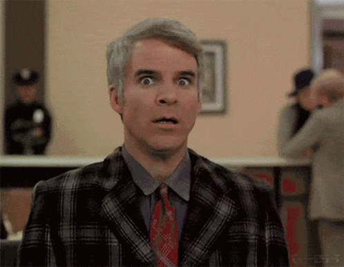 Man in Plaid Suit Making Surprised Face
