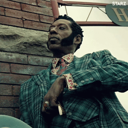 Man in Plaid Suit Smoking Cigarette