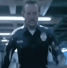 Man in Police Uniform Standing