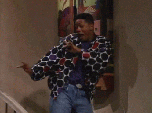 Man in Polka Dot Jacket on Stairs