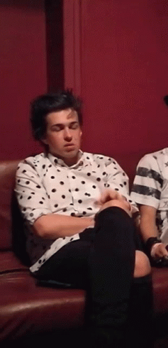 Man in Polka Dot Shirt Eyes Closed