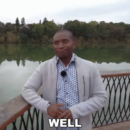Man in Polka Dot Shirt Saying Well