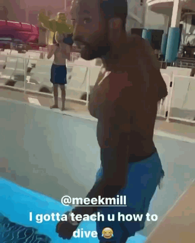 Man in Pool Teaching Dive