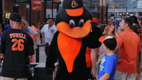 Man in Powell 26 Jersey Next to Mascot