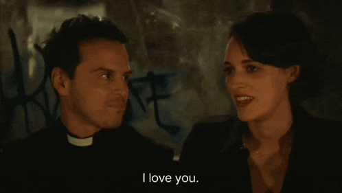 Man In Priest Collar Looking At Another Man GIF