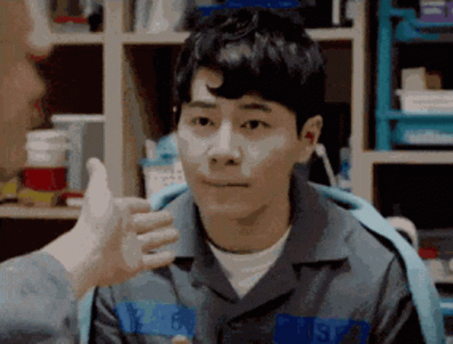 Man in Prison Uniform Giving Thumbs Up