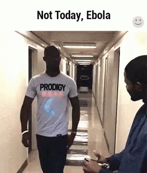 Man in Prodigy Shirt Walking with Another Man
