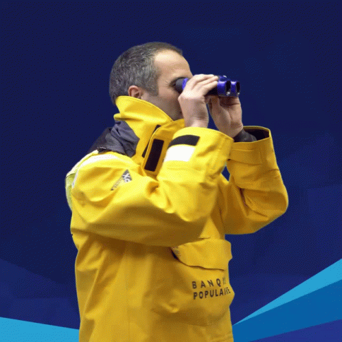 Man In Protective Suit Using Binoculars GIF