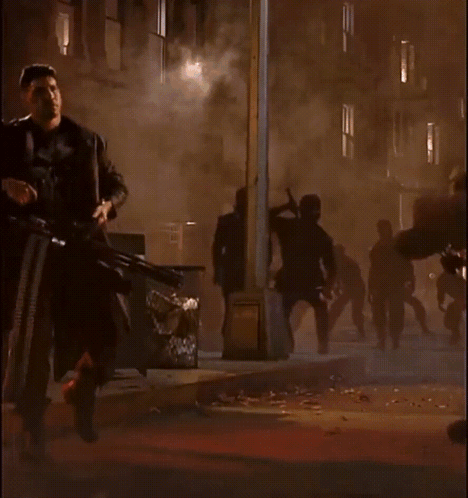 Man In Punisher Costume Holding Gun GIF