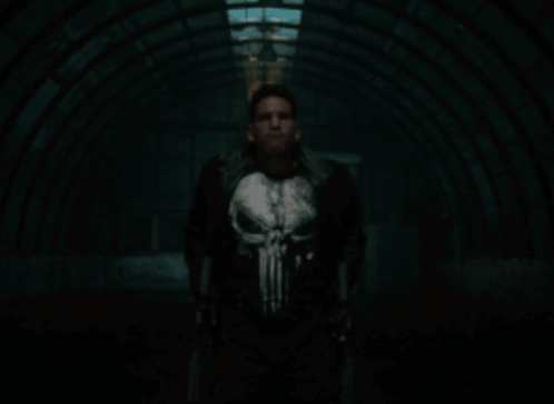 Man in Punisher Costume Holding Guns