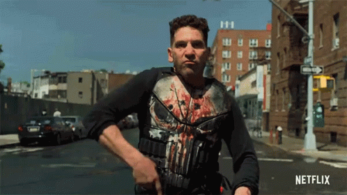 Man in Punisher Shirt Walking