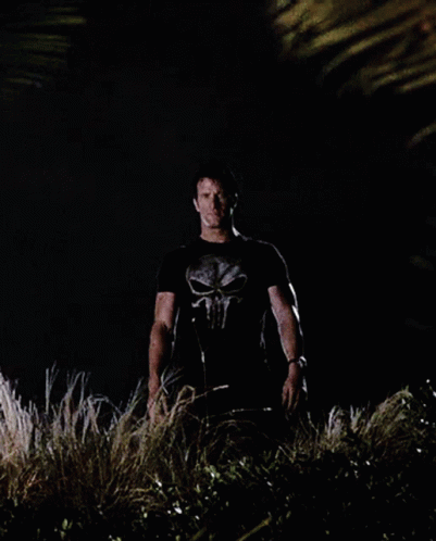 Man in Punisher T-Shirt in Darkness