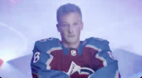 Man in Purple and Blue Jersey Number 6