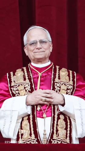 Man in Purple and Gold Robe Arms Crossed