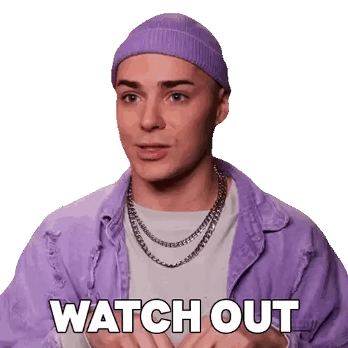 Man in Purple Beanie and Jacket Says Watch Out