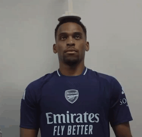 Man in Purple Emirates Fly Better Shirt